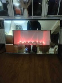 Mirrored wall-hanging eletric fire