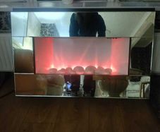 Mirrored wall-hanging eletric fire