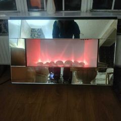Mirrored wall-hanging eletric fire