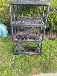 two plastic shelving units
