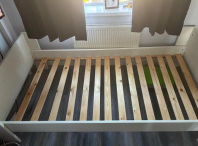 White single bed frame with wooden slats