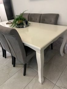 8 seater dining table and 6 grey velvet button detailing chairs