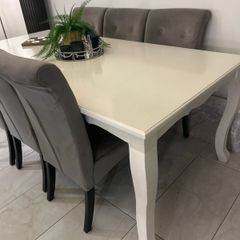 8 seater dining table and 6 grey velvet button detailing chairs
