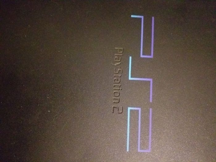 Sony PlayStation 2 console with two controllers