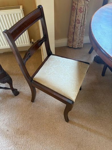 Antique dining table and 6 chairs.