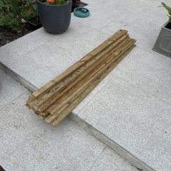 23 lengths of treated wood approx 1.3m long