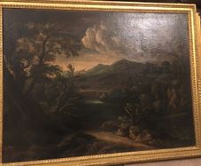 Circle of Francesco Zuccarelli  mountainous landscape by a lake with a fortress