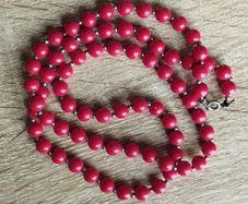 Vintage necklace with red and gold beads.
