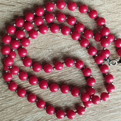 Vintage necklace with red and gold beads.