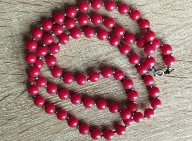 Vintage necklace with red and gold beads.