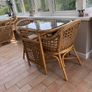 Cane dining table and chairs Image 3
