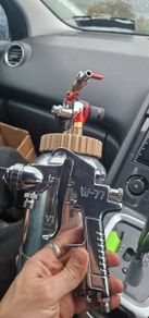 Paint spray gun with pot tank, a W-77 model nozzle.