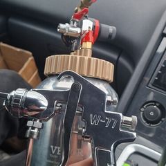 Paint spray gun with pot tank, a W-77 model nozzle.