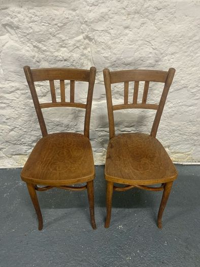 A pair of tall Thonet bentwood chairs.