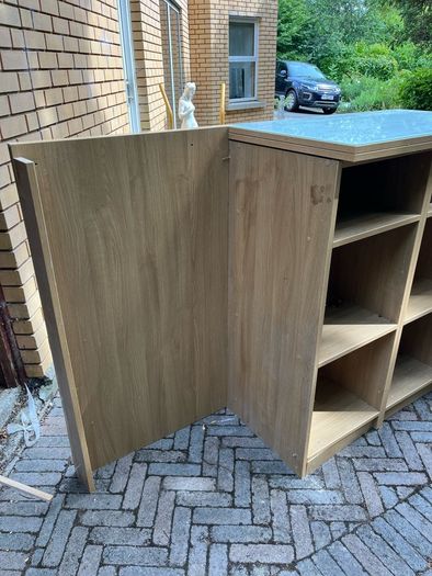 Veneered oak shelving unit with glass top