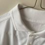 2 dunnes white polo shirts (as new) age 9-10 Image 4
