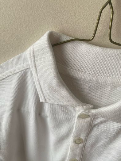2 dunnes white polo shirts (as new) age 9-10