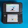 New 3DS XL Metallic Black with Games & Case Image 3