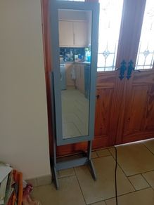 Grey freestanding jewellery cabinet with mirror