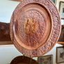 Beautiful vintage hand-carved wooden tray featuring an intricate floral border and a decorative brass inlay geometric star motif in the centre. The craftsmanship is detailed and very tactile, giving this piece a rich, warm character. The tray is solid and Image 2