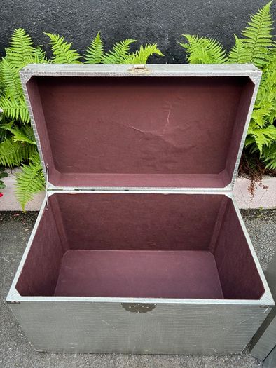 3 silver coloured tables and chest