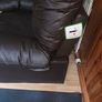 dark brown faux leather armchair. Image 8