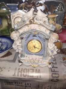 Porcelain Mantel Clock with Two Cherubs and Two Doves on top, and floral accents, Postage Available