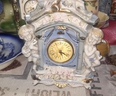 Porcelain Mantel Clock with Two Cherubs and Two Doves on top, and floral accents, Postage Available