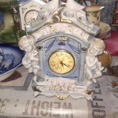 Porcelain Mantel Clock with Two Cherubs and Two Doves on top, and floral accents, Postage Available