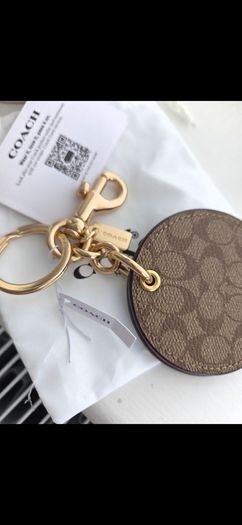 Coach mirror charm