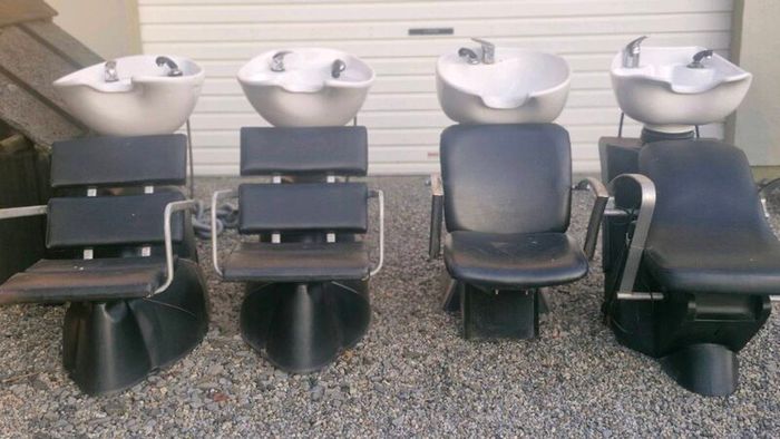 Hair salon sinks and chirs and treatment table