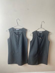 2 M&S grey pinafores (as new) age 9-10