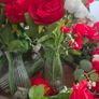 Red and white flowers in vases Image 5