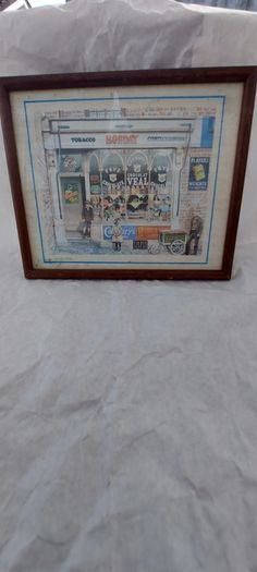 Old advertising shop front picture print ,different brands for sale, in the shop,nice for any home bar or man cave pub restaurant etc,,buyer collects thank you,, rather buyer collects with the glass ,sold as is ,,see pictures for condition