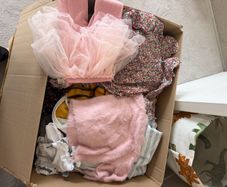 Box of new and worn girls cloths