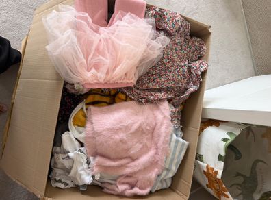Box of new and worn girls cloths