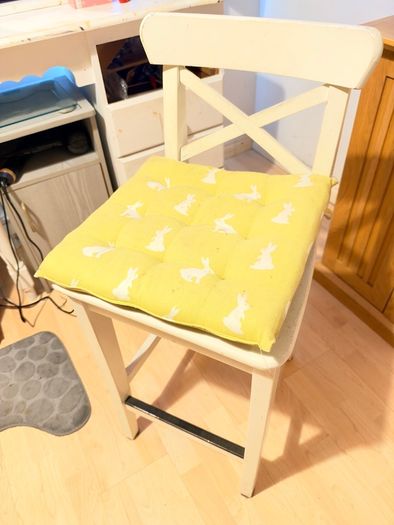 White wooden cross-back bar stool