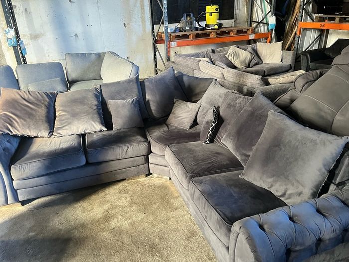Grey corner sofa with scatter cushions