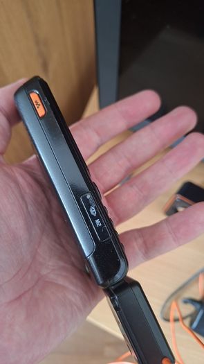 Sony Ericsson W200i , with charger and speakers.