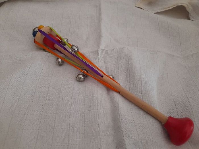 Child's wooden rattle with bells