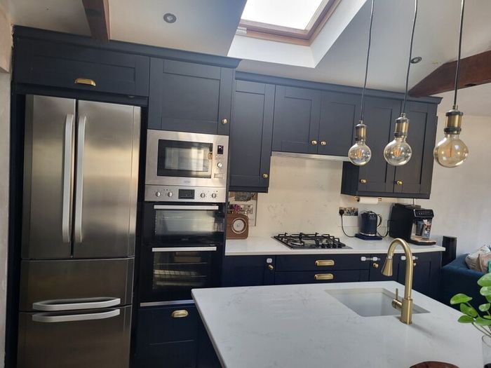 Kitchen units, island and quartz worktops.