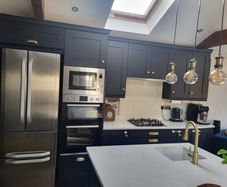Kitchen units, island and quartz worktops.