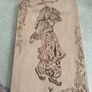 a piece of wood art featuring a pyrography (wood-burning) design of a woman in traditional attire. Image 7