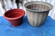 2 weathered plastic flower pots