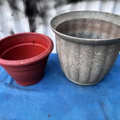 2 weathered plastic flower pots