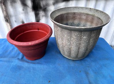 2 weathered plastic flower pots