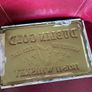 Vintage 'Dublin Gold' metal bar display Image 3