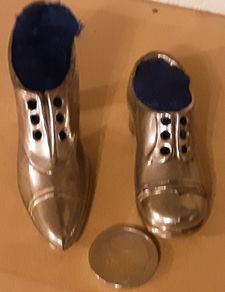 two nice white metal pin cushions