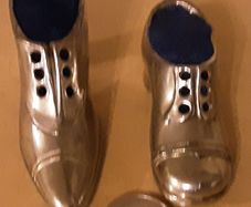 two nice white metal pin cushions