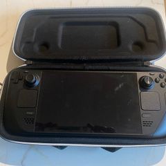 Steam Deck/ carry case and charger.